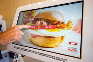 Self-serve screen in fried chicken restaurant