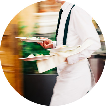 Waiter carrying food to table