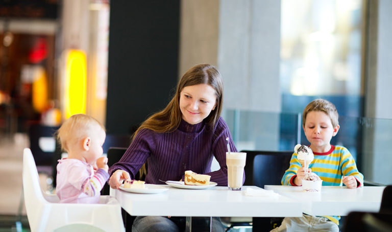 Mum having food with her children in a restaurant